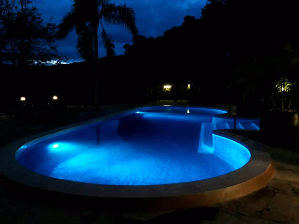 The Plantation Lodge, Karatu — Pool at dusk