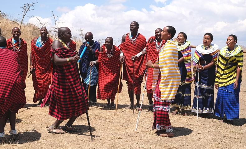 Maasai community gathered in traditional red and colorful clothing